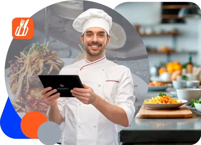 Chef con una tablet revisando el inventario de ingredientes del restaurante en Wanqara