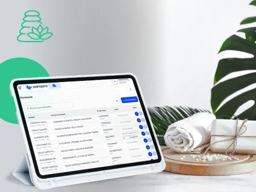 Tablet con los reportes de ingresos y egresos de Wanqara sobre la mesa de un spa